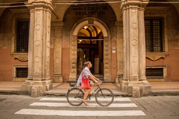 Girl riding a bike in Bologna