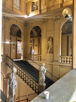The grand staircase of Palazzo Hercolani, the headquarter of the Department of Political Science in Bologna